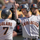 Donovan Solano and Austin Slater of the San Francisco Giants celebrate after Solano hit a pinch-hit two-run home run against the Oakland Athletics in the top of the eighth inning at RingCentral Coliseum.